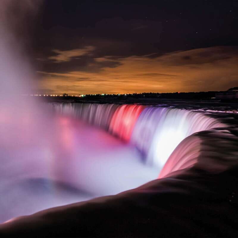 From Toronto: Niagara Falls Tour with Journey & Dinner - Clifton Hill in Winter: Lights, Noise, and a Real Break