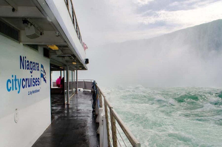 Niagara Falls Day Tour with Boat Ride & Journey Behind Falls - Hornblower Niagara Cruises: getting soaked with skip-the-line express tickets
